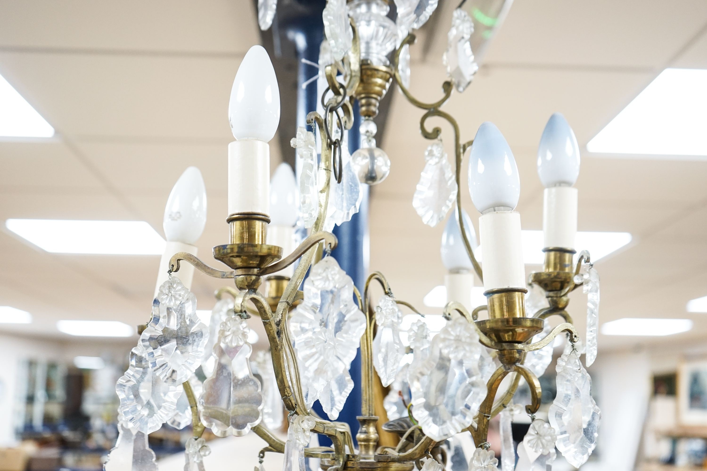 A six branch brass and glass lustre hung chandelier, height 60cm